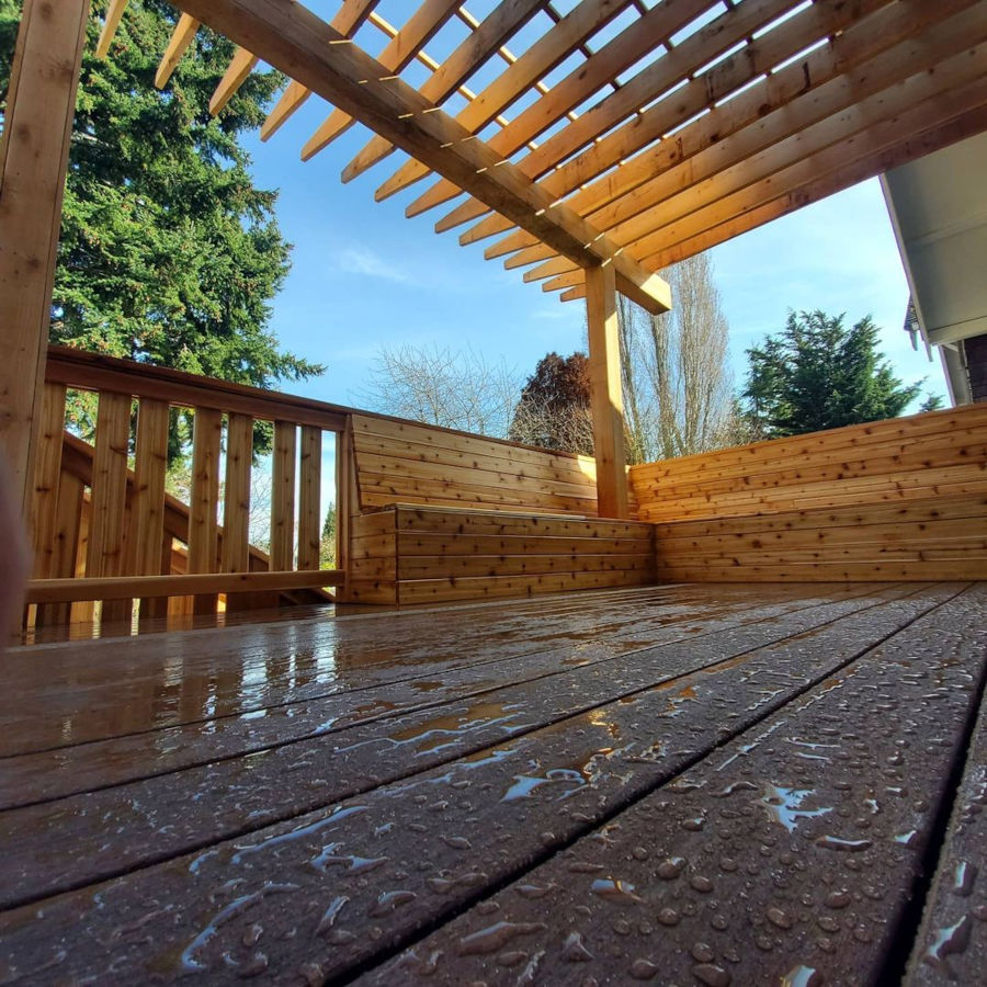 Cedar wood railing, pergola, and benches with privacy wall and composite decking