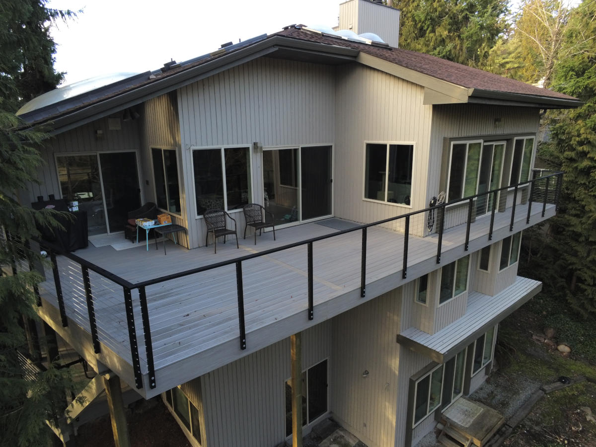 Balcony deck w/ Maisy Rail cable railing and composite decking in Bellevue, WA