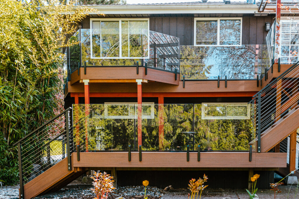multi level deck with frameless glass and cable railing